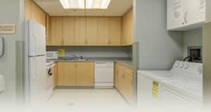 A small kitchen and washing machine at Ivy Park